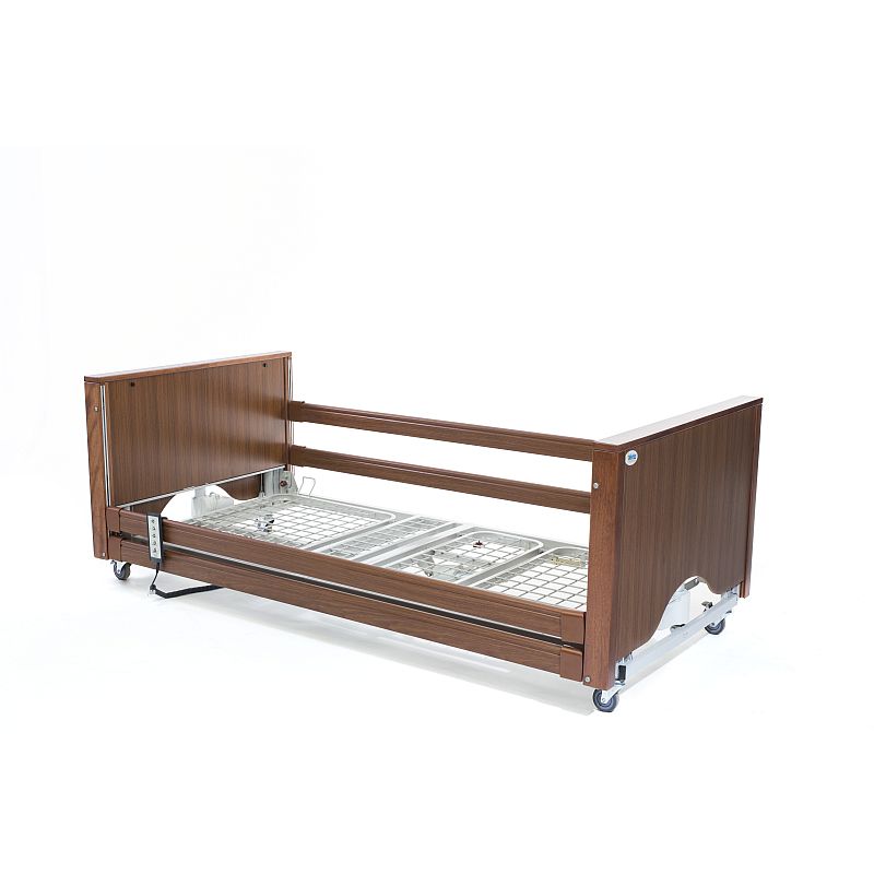 A low oak wood bed frame with a side rail and mattress platform