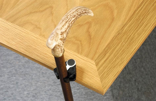 The Clip-on Cane/Crutch Holder improves safety and convenience in a variety of spaces
