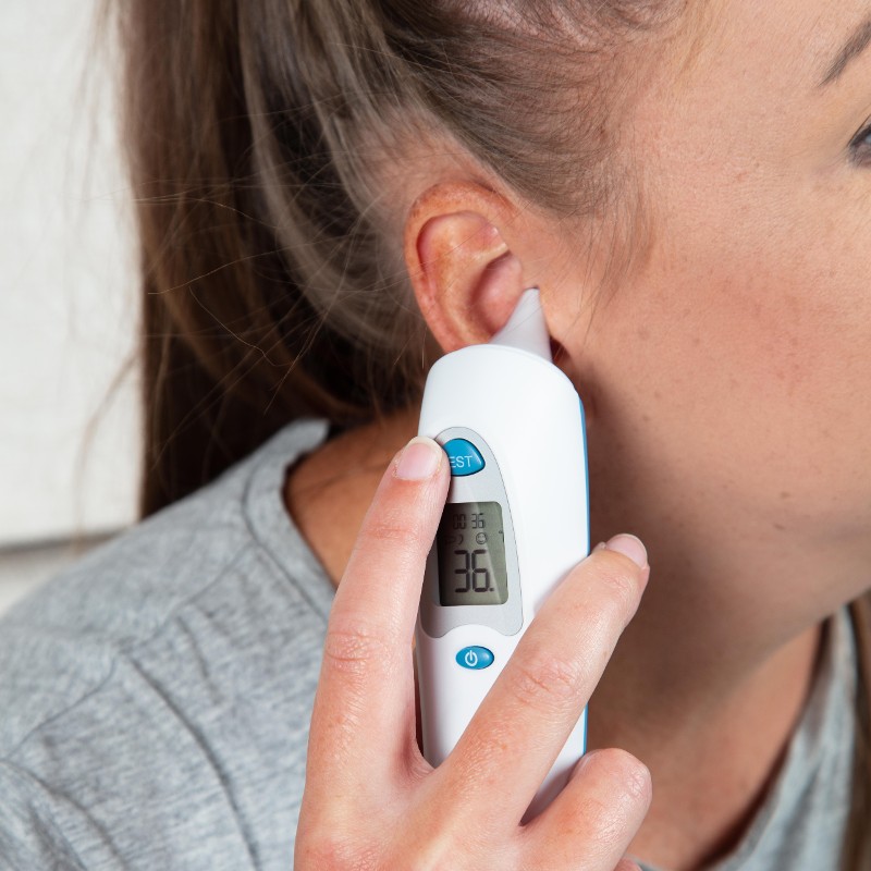 woman using Drive in-ear thermometre DET-103