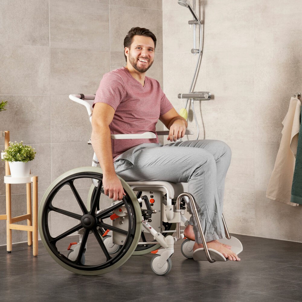 The Etac Mobil 24"-2 Shower Commode Chair is self-propelled for independent use